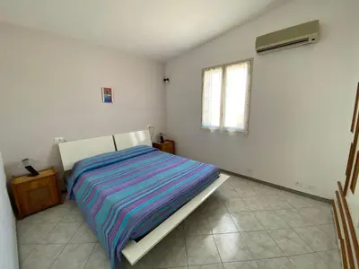 Letto o letti in una camera di Villa Amos Marzamemi San Lorenzo