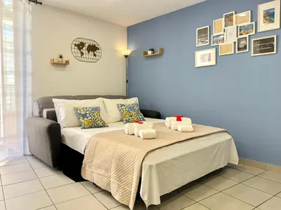 Letto o letti in una camera di KataSoul Urban Vibes - Catania Centro Storico - Moderno - Balcone - 4 Posti Letto