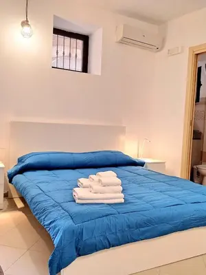 Letto o letti in una camera di Nata Sicula 2