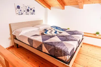 Letto o letti in una camera di la casa di carta al centro storico