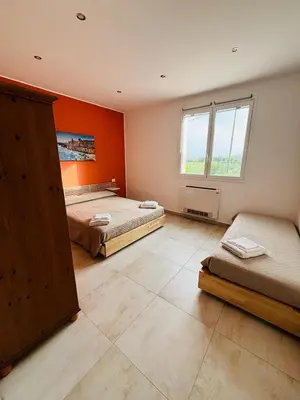 Letto o letti in una camera di Come a casa