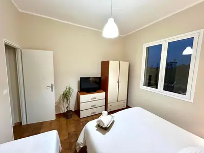 Letto o letti in una camera di L'arco di Elisa
