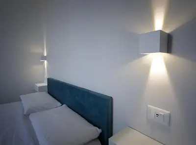 Letto o letti in una camera di Regina Margherita Apartments