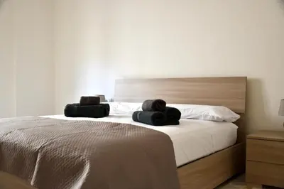 Letto o letti in una camera di Vela Barocca