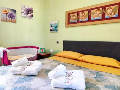 Letto o letti in una camera di Suite Harmony