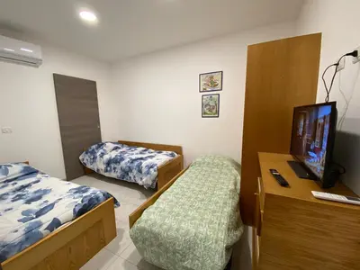 Letto o letti in una camera di MaGa House