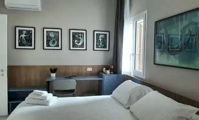 Letto o letti in una camera di Vittoria Rooms