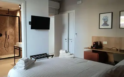 Letto o letti in una camera di Vittoria Rooms