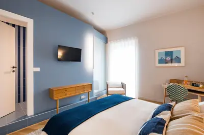 Letto o letti in una camera di Al Monumento