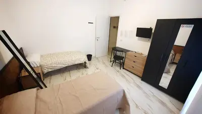 Letto o letti in una camera di Al Cortiletto