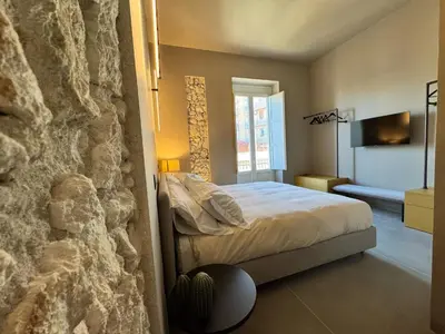 Letto o letti in una camera di Vittoria 61 Apartment