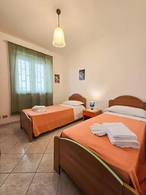 Letto o letti in una camera di Villa Clelia 400 meters from the beach