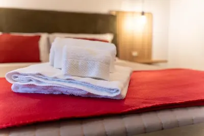 Letto o letti in una camera di Domus Juvenilia