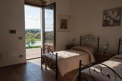 Letto o letti in una camera di La Goccia D'oro