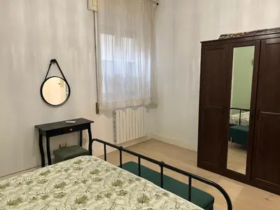 Letto o letti in una camera di Riviera Suite Via Eveneto, 47