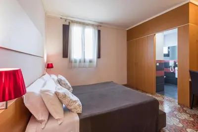 Letto o letti in una camera di Hotel Vittorio Veneto