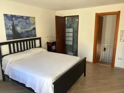 Letto o letti in una camera di Domus Poseidone