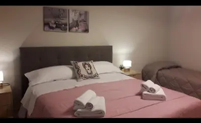 Letto o letti in una camera di La Chiocciola Apartments