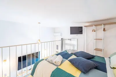 Letto o letti in una camera di Home Eleinad appartamento elegante a pochi passi da Ortigia