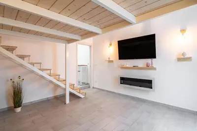 TV o dispositivi per l'intrattenimento presso Home Eleinad appartamento elegante a pochi passi da Ortigia