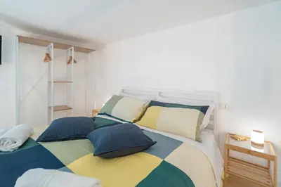 Letto o letti in una camera di Home Eleinad appartamento elegante a pochi passi da Ortigia