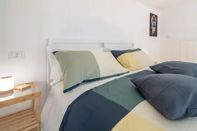 Letto o letti in una camera di Home Eleinad appartamento elegante a pochi passi da Ortigia