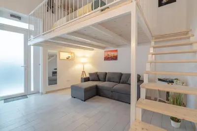 Area soggiorno di Home Eleinad appartamento elegante a pochi passi da Ortigia