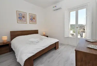 Letto o letti in una camera di Sud Casa Vacanze