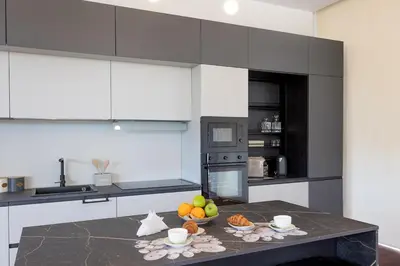 Cucina o angolo cottura di Numeroquattro-Light Green, Open Space con vista sul giardino e piscina