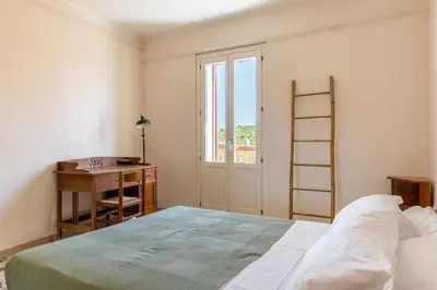 Letto o letti in una camera di Casa Verga con Terrazza by Wonderful Italy