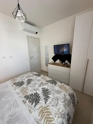 Letto o letti in una camera di AcquaLuce Home Marzamemi