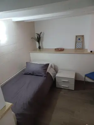 Letto o letti in una camera di Casa Antonella