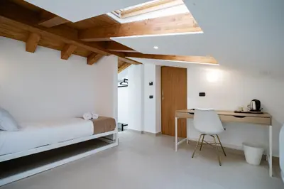 Letto o letti in una camera di Lux Santa Lucia