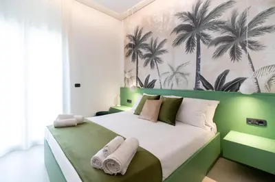 Letto o letti in una camera di Lux Santa Lucia