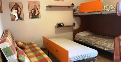 Letto o letti in una camera di Villa degli Ibiscus