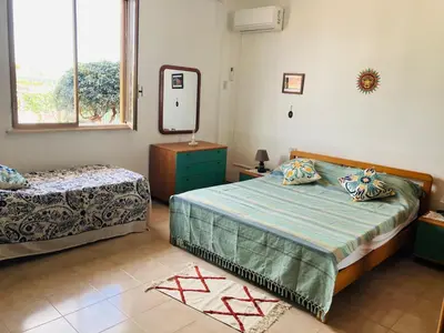 Letto o letti in una camera di Villetta Zagara