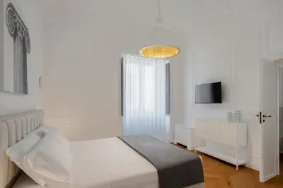 Letto o letti in una camera di Palazzo Palmeri Rooms