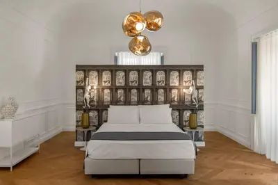 Letto o letti in una camera di Palazzo Palmeri Rooms