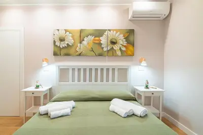 Letto o letti in una camera di Borgo Luciana