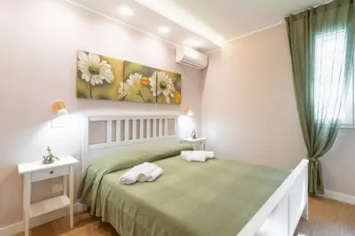 Letto o letti in una camera di Borgo Luciana