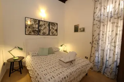 Letto o letti in una camera di Casina Ortigia