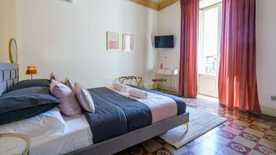 Letto o letti in una camera di Sicilia Experience - Palazzo Nouveau