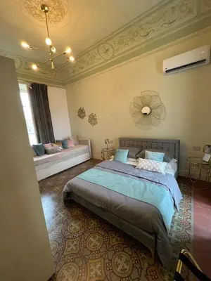 Letto o letti in una camera di Sicilia Experience - Palazzo Nouveau