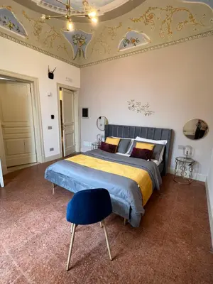 Letto o letti in una camera di Sicilia Experience - Palazzo Nouveau