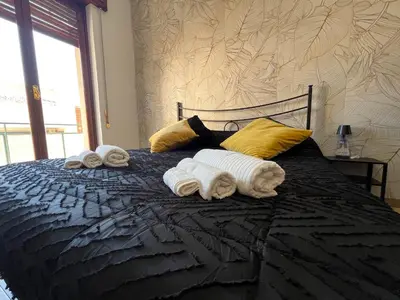 Letto o letti in una camera di Periperihomesiracusa