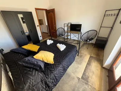 Letto o letti in una camera di Periperihomesiracusa