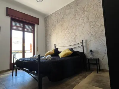Letto o letti in una camera di Periperihomesiracusa
