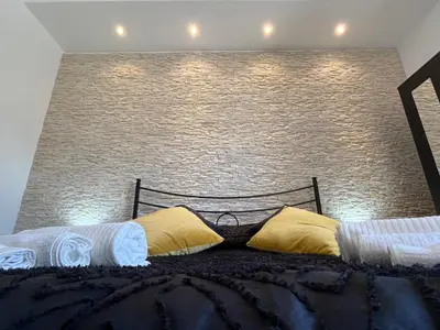 Letto o letti in una camera di Periperihomesiracusa