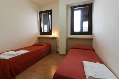 Letto o letti in una camera di Poseidon