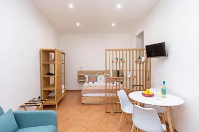 TV o dispositivi per l'intrattenimento presso Domus 116 Ortigia by Ortigiaapartments